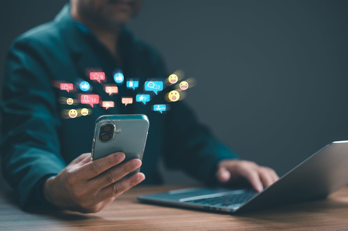 Business person managing social media marketing campaigns through a mobile device